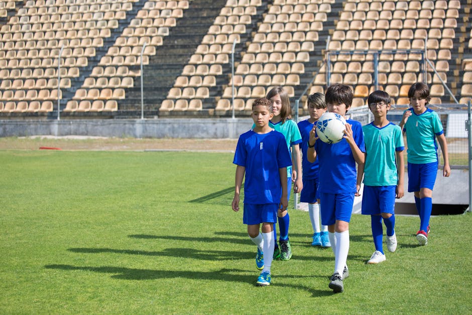 Children playing football at Hecevua Academy